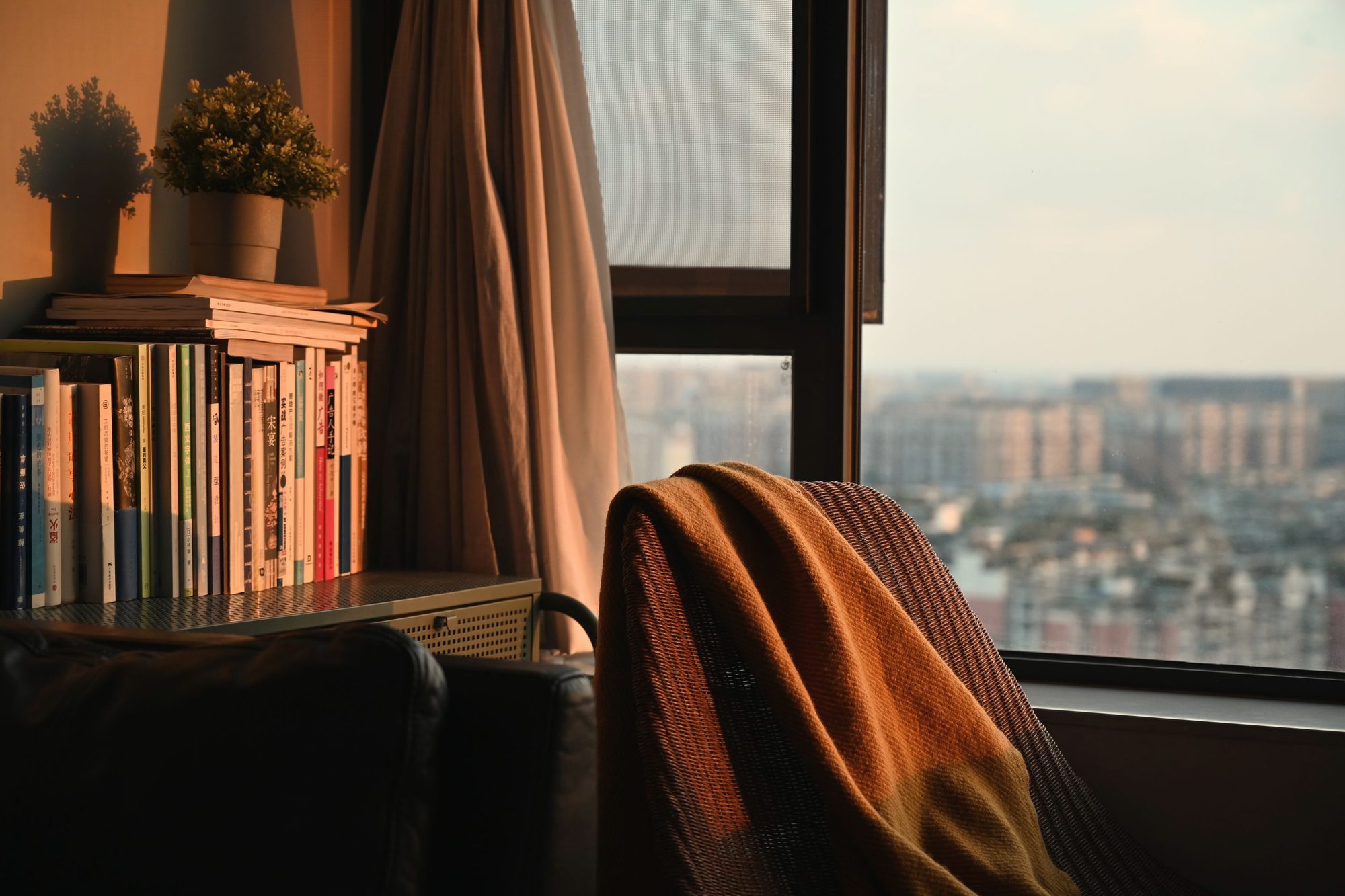 High-floor window with a city view at golden hour