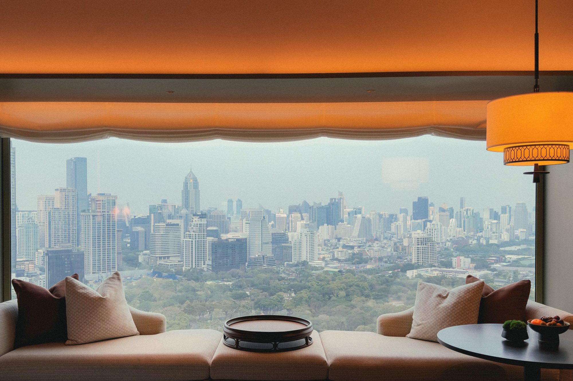 Window seat looking out over a city skyline