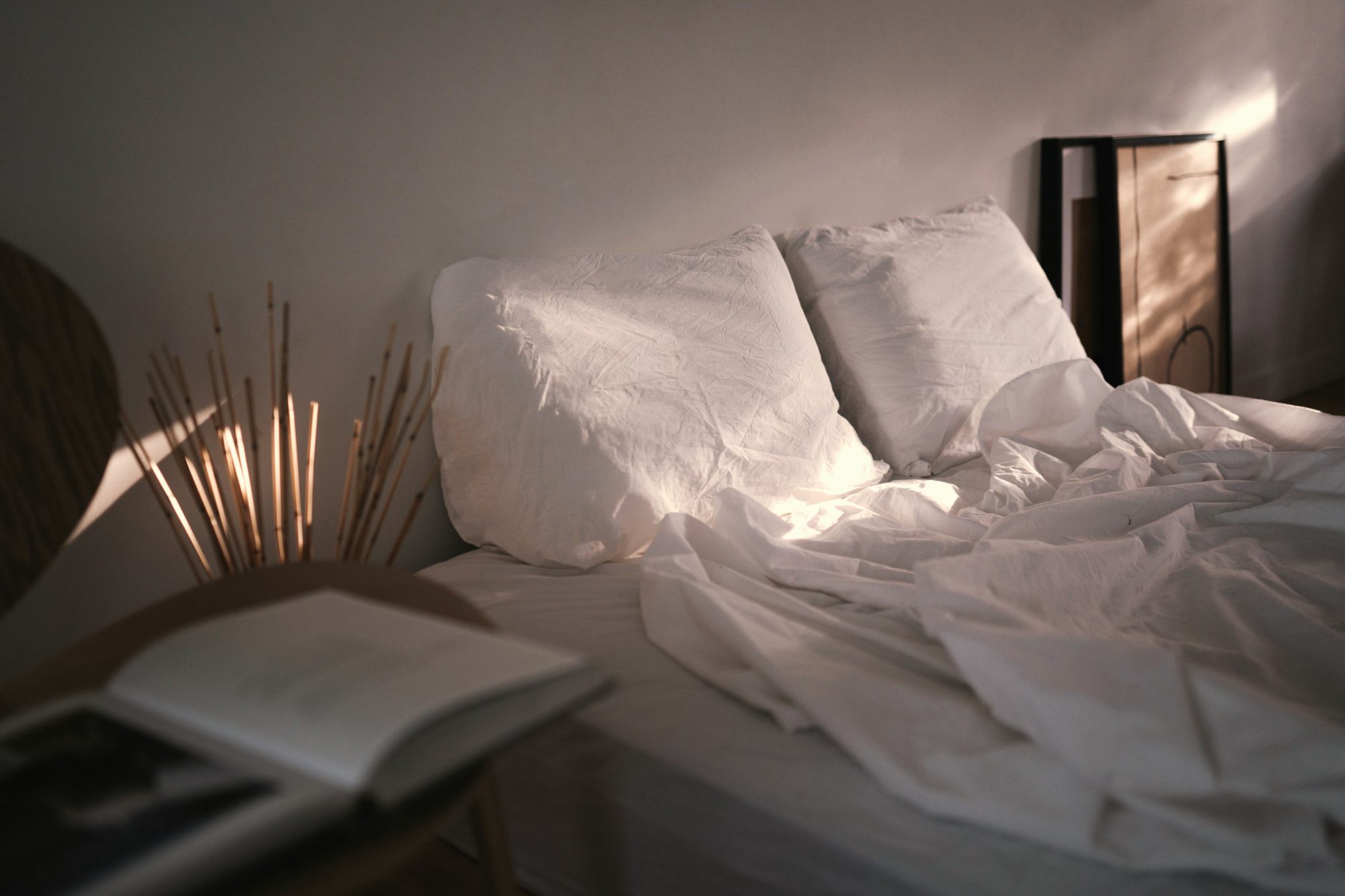 Linen bed in soft raking light